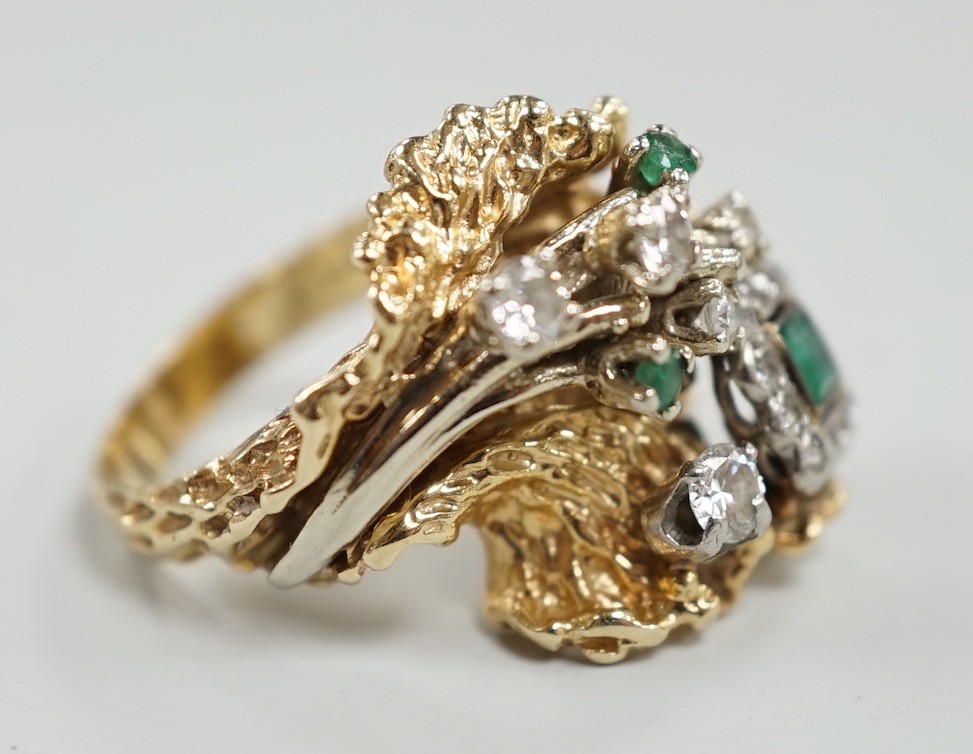 A modern 14k, emerald and diamond cluster set modernist dress ring, size L, gross weight 13.4 grams.
